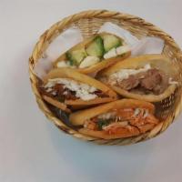 Arepa Basket Bundle · 4 mini arepas with filling and cheese 1 avocado, 1 shredded beef, 1 shredded chicken, 1 roas...
