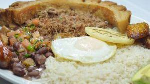 Bandeja Paisa · (Country Dish) - ground beef, sweet plantain, fried pork belly, chorizo, corn cake, fried eg...