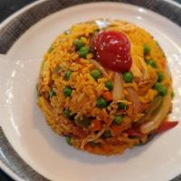 Arroz Con Pollo Colombiano · Seasoned sauteed rice mixed with chicken and vegetables, Served with sweet plantains