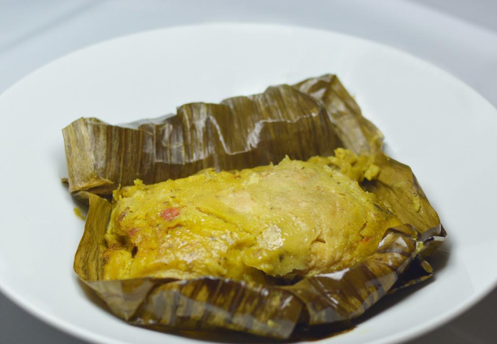 Tamal  Colombiano · Colombian tamales  all wrapped on banana leaves corn dough with carrot, peas, potatoes, piece of chicken ,
piece of pork ribs and a piece of pork bely,  seasoned with onions ,tomatoes and test chicken broth all wrapped on banana leaves  slow  steam to
cook.