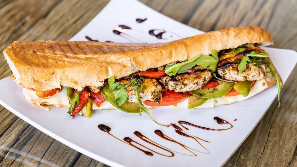 Grilled Chicken Panini · Pesto, avocado, tomato, basil, roasted red peppers and American cheese.