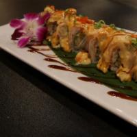 Fireworks · Shrimp tempura, avocado inside, topped crabmeat with sweet and spicy seafood sauce.