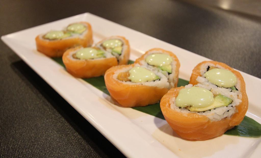 Salmon Lover · Spicy salmon, avocado inside topped with salmon and wasabi mayo.