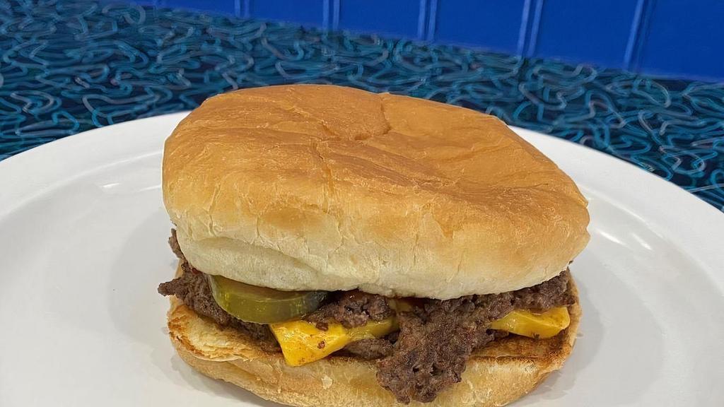 Double Cheese Burger · Two fresh ground beef patties, made daily, on a toasted bun. Comes with our signature yellow cheese.