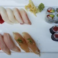 Sushi Deluxe · Chef's choice of nigiri sushi (12 pieces), tuna roll, and California roll.