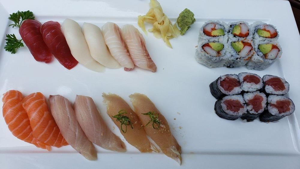 Sushi Deluxe · Chef's choice of nigiri sushi (12 pieces), tuna roll, and California roll.
