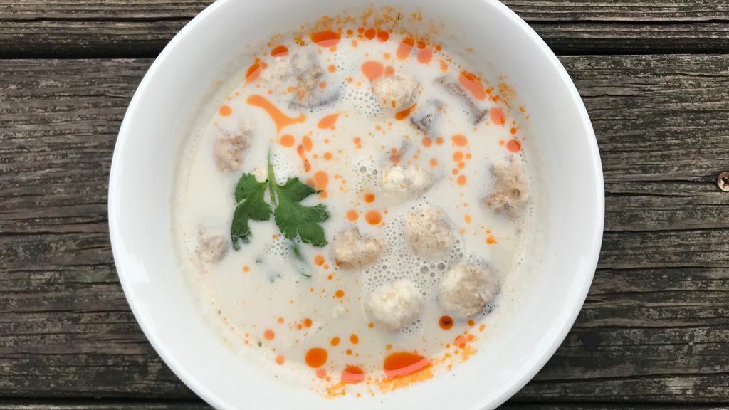 Tom Kha Chicken · Coconut soup with chicken, mushrooms and a touch of galangal.