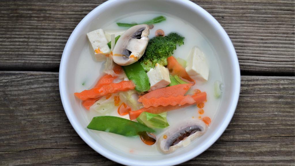 Vegetarian Tom Kha · Coconut soup with tofu, vegetables and a touch of galangal.