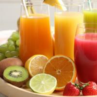 Green Sunshine Juice · Fresh orange, grapefruit, pineapple, and apple.