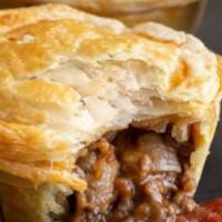 Meat Pies · Ground beef, onions, tomatoes, and spices.