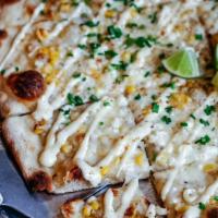 Large Mexican Street Corn (Takeout) · roasted garlic base, fire roasted corn, house-made queso fresco, hosue blend cheese, topped ...