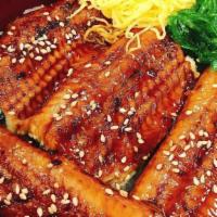 Una Don · Broiled eel glazed with special tangy sauce over rice. Served with miso soup or garden salad.