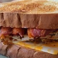 Beef Bacon, Egg, & Cheese Sandwich · Fluffy scrambled organic eggs, cooper sharp cheese, halal beef bacon on a Texas toast.