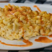 Black Folk Style Baked Mac & Cheese · Elbow macaroni, three cheeses, and bake till bubbly.