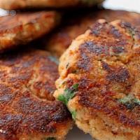 Salmon Cake (2 Pieces) · (2) Salmon cakes served with a choice of grits or home fries.