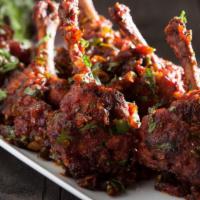 Drums Of Heaven · Tender chicken wings cooked with garlic butter and indian spices.