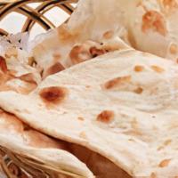 Naan · All natural flour bread cooked in clay oven.