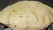 Roti · All-natural wheat bread cooked in clay oven.