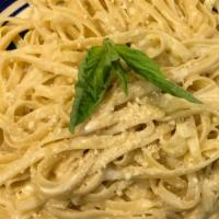 Fettuccine Alfredo · Fettuccine Sautéed in our House Cream Sauce and Parmigiano Cheese