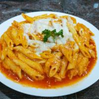 Baked Ziti · A Delightful Blend of Ricotta, Parmigiano, and Mozzarella Cheese Baked to Perfection with Pe...