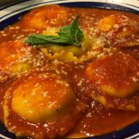 Cheese Ravioli · Pillows of Pasta Filled with Ricotta, Topped with Tomato Sauce and Parmigiano Cheese