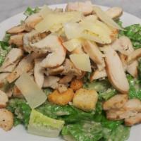 Chicken Caesar Salad · Romaine Lettuce, Shaved Parmigiano, Croutons and Caesar Dressing.