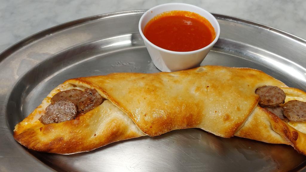 Sausage Pizza Roll · Italian sausage Pizza Roll, have sausage and mozzarella rolled up in pizza dough. Dip them in warm tomato sauce for the full pizza experience. These can be served as an appetizer or as a main course.
Served with cup of sauce.