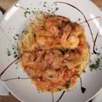 Shrimp & Scallops · Seared shrimp and scallops in our house-made brandy cream sauce, served over spaghetti.