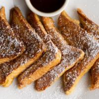 French Toast · Three pieces of thick Texas toast dipped in our french toast batter and grilled.