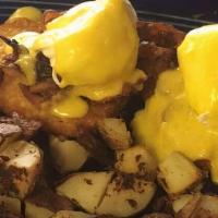 Brandon'S Benedict · Crispy fried hash brown topped with bacon, two poached eggs, our homemade buffalo aioli, and...