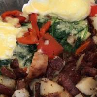 Crab Cake Benedict · Tom's homemade crab cakes topped with sautéed baby spinach, roasted red peppers and two poac...