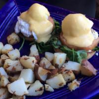 Vermont Benedict · Toasted English muffin topped with goat cheese, sautéed baby spinach, tomato, two poached eg...