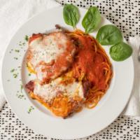 Chicken Parmigiana · Breaded chicken breast with homemade tomato sauce and baked with mozzarella.