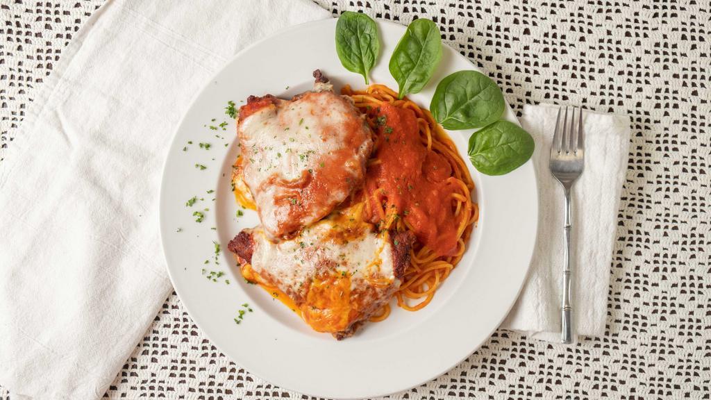 Chicken Parmigiana · Breaded chicken breast with homemade tomato sauce and baked with mozzarella.