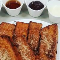Cinnamon Sticks Entree · Brioche French toast covered in cinnamon
and sugar, served with Creme Anglaise.