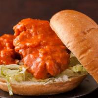 Crispy Buffalo Chicken Sandwich · Crispy chicken breast drizzled with buffalo sauce on a soft sandwich roll with a side of cre...