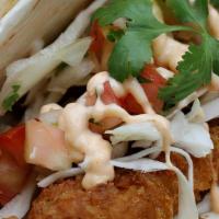 Grilled Chicken Soft Tacos · 2 Soft tacos filled with Grilled Chicken, slaw, & Yum Yum sauce on a soft sandwich roll with...
