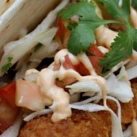 Crispy Shrimp Soft Tacos · 2 Soft tacos filled with Crispy Shrimp, slaw, & Yum Yum sauce on a soft sandwich roll with a...