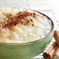 Rice Pudding · Large 8 oz. portion of creamy sweet rice pudding topped with cinnamon.