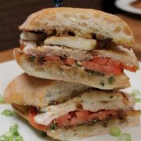 Chicken Caprese Sandwich · Fresh mozzarella, basil, and tomato pressed on ciabatta. Served with choice of side.