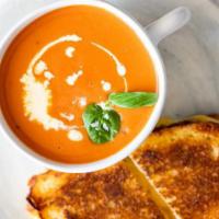 Grilled Cheese And Tomato Soup · Grilled Cheddar and American Cheese with Tomato on Club Bread with Tomato Soup.