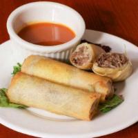 Cheesesteak Spring Rolls · Chip steak, onions and American cheese in a crispy shell.