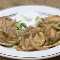 Cheddar Pierogies · Pan-fried with sour cream and caramelized onions.