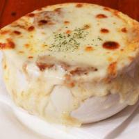 French Onion Soup · Melted provolone and swiss cheese.
