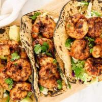 Shrimp Tacos · Shrimp, Shredded Lettuce, Chipotle Salsa, Jalapenos, Pico de Gallo, Avocado Ranch, and Lime