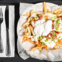 Loaded Fries · Bacon, sour cream, cheese, and scallions.