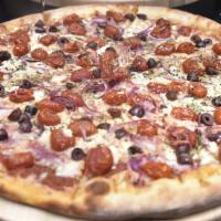 The Greek Pie · Our tomato sauce, mozz, feta cheese, roasted tomatoes, red onions, kalamata olives, fresh or...