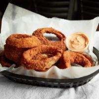 Homemade Onion Rings · Served with our homemade Texas pedal sauce.