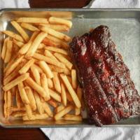 Half Rack Ribs With One Side · The best slow smoked baby back pork ribs smothered in our smoky bbq sauce. entrees include g...