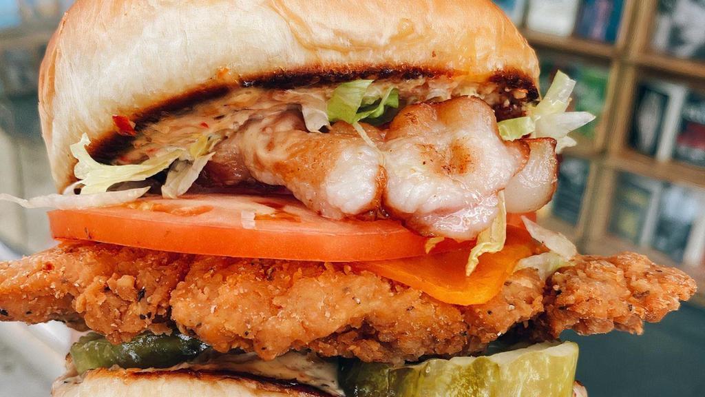 Club Fed · fried chicken breast, bacon, cheddar cheese, shredded lettuce, tomato, pickles, topped with cherry pepper aioli on a brioche bun